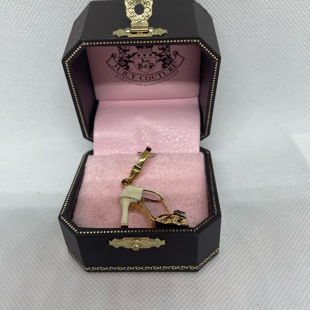 Juicy Couture peep toe white and gold shoe .